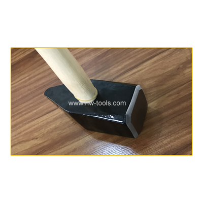 stone hammer with wooden hammer