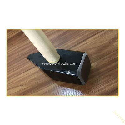 stone hammer with wooden hammer
